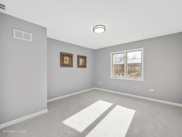 unfurnished room with light colored carpet