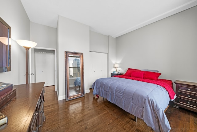 bedroom with dark wood-type flooring