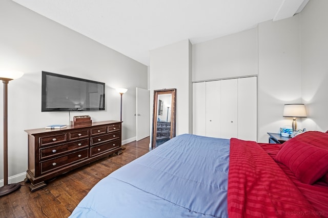 bedroom featuring a closet and dark hardwood / wood-style flooring