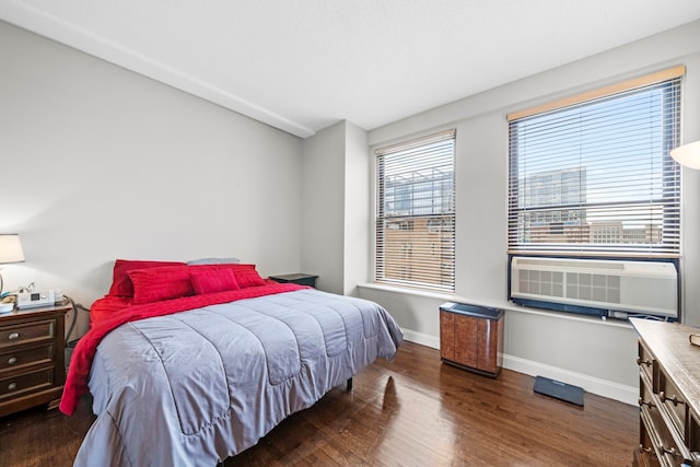 bedroom with dark wood-type flooring