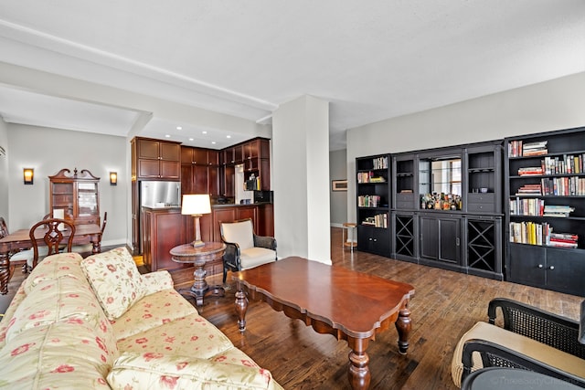 living room with dark hardwood / wood-style flooring