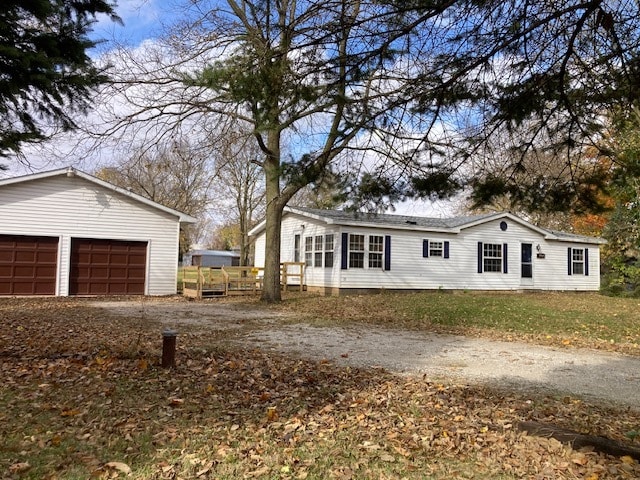 view of front of home with an outdoor structure and a garage