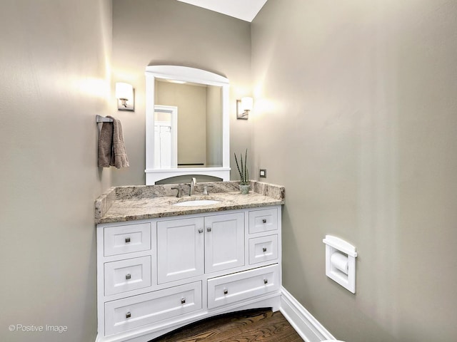 bathroom with vanity and hardwood / wood-style floors