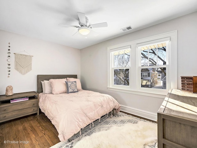 bedroom featuring dark hardwood / wood-style floors and ceiling fan