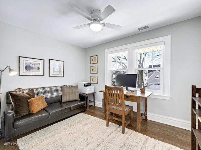 office space featuring ceiling fan and dark hardwood / wood-style floors