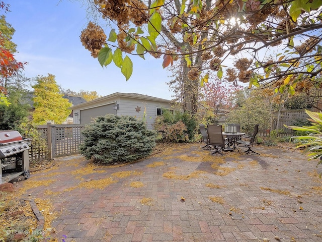 view of patio featuring a grill