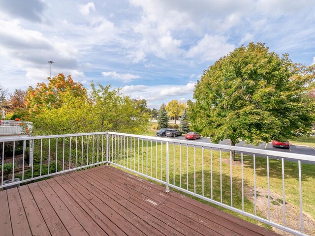 wooden deck with a yard