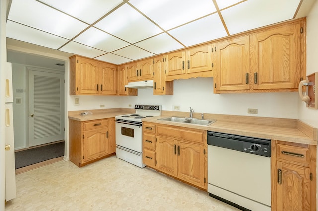 kitchen featuring white appliances and sink