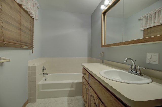 bathroom featuring vanity and a tub