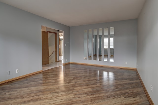 spare room featuring wood-type flooring