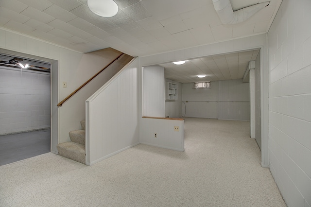 basement with light colored carpet