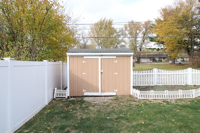 view of outbuilding with a yard