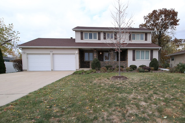 front of property featuring a front yard and a garage