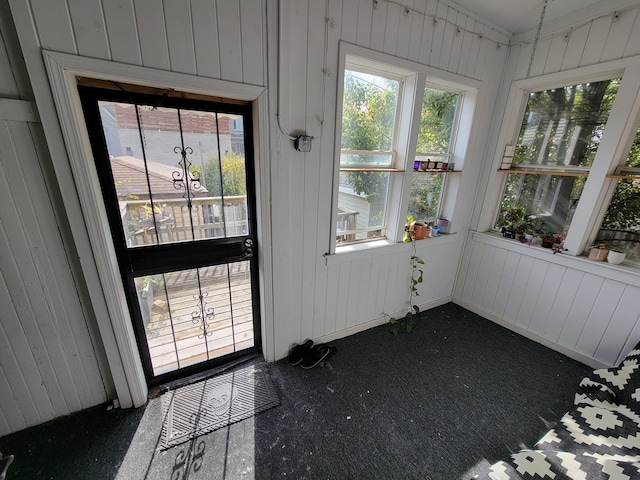 unfurnished sunroom with a wealth of natural light