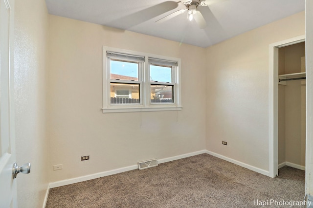 unfurnished bedroom with carpet, ceiling fan, and a closet