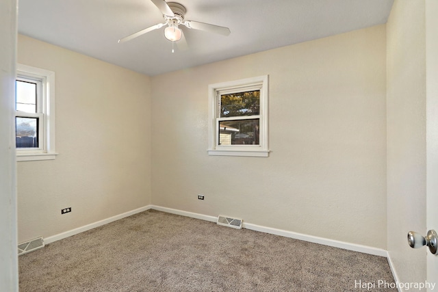 carpeted empty room with ceiling fan