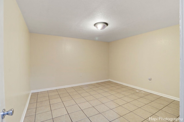 empty room featuring a textured ceiling