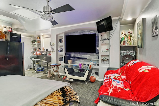 bedroom with stainless steel refrigerator and ceiling fan