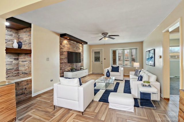 living room with light parquet floors and ceiling fan