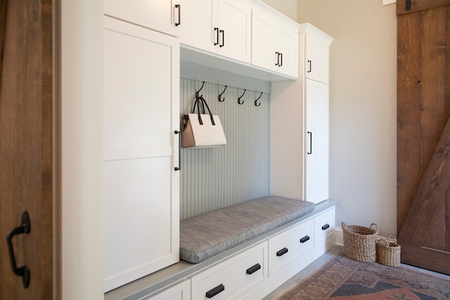 mudroom featuring a barn door