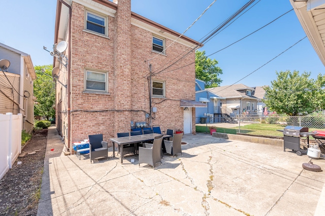 rear view of house with a patio