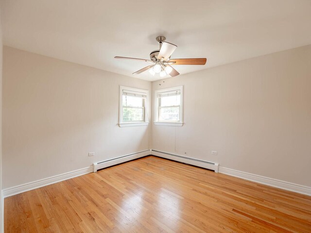 unfurnished bedroom with a baseboard radiator, light wood-type flooring, cooling unit, a closet, and ceiling fan