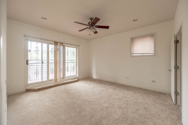 empty room with light carpet and ceiling fan