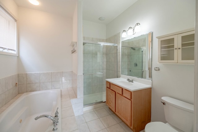 full bathroom featuring vanity, plus walk in shower, toilet, and tile patterned flooring