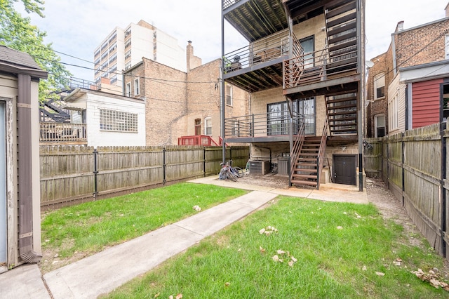 view of yard with a balcony