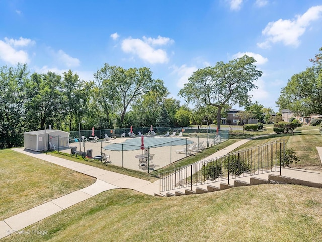 view of pool with a yard