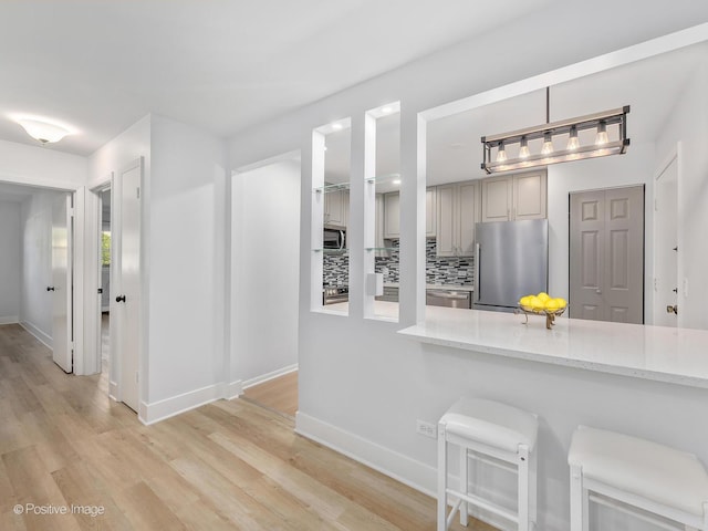 interior space featuring hardwood / wood-style floors and tasteful backsplash