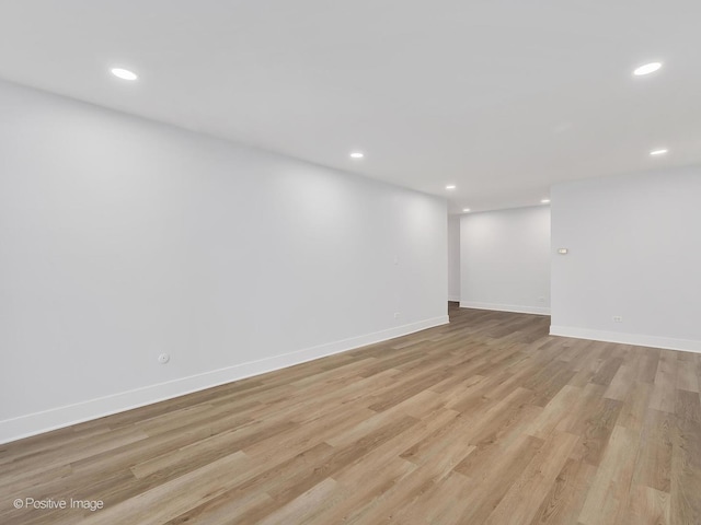 spare room with light hardwood / wood-style floors