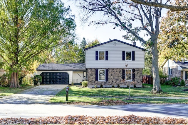 view of front of home with a garage and a front lawn