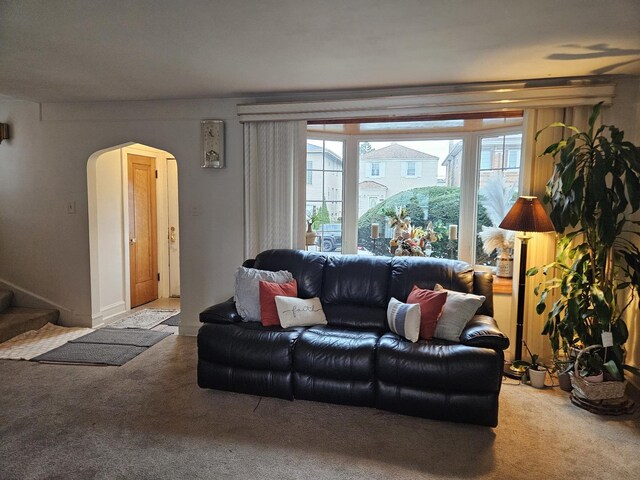 1639 Clarence Ave, Berwyn, IL 60402 - carpeted living room with arched walkways and stairs