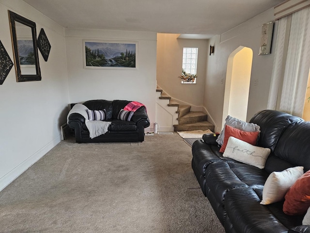 1639 Clarence Ave, Berwyn, IL 60402 - living area with carpet, arched walkways, stairs, and baseboards