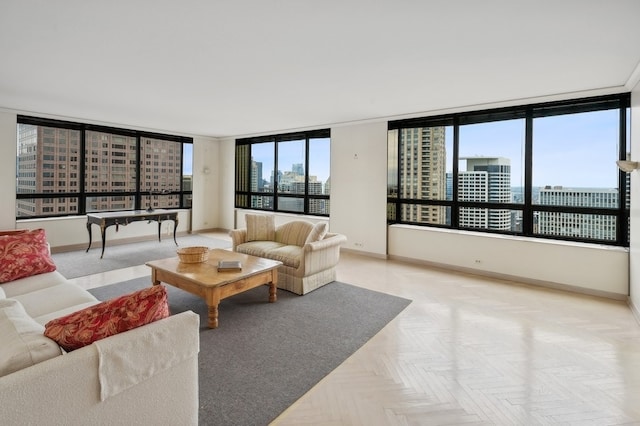 living room with light parquet flooring and floor to ceiling windows