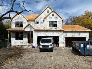 unfinished property with a garage