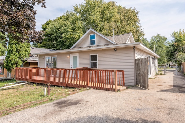 back of property with a wooden deck