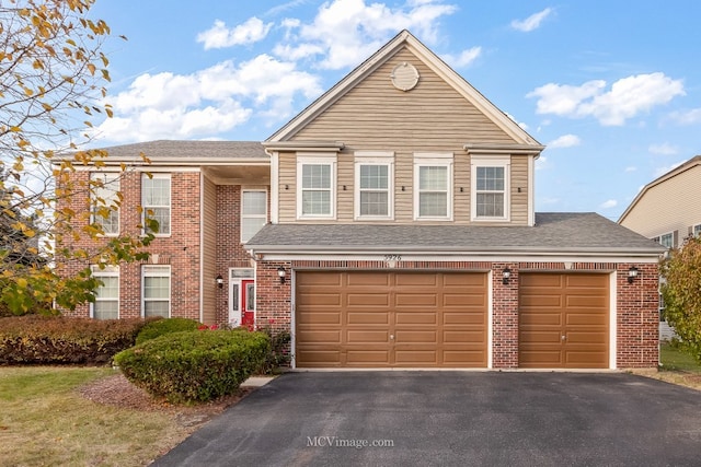 front facade with a garage