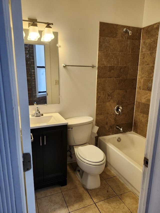 6410 N Hoyne Ave Unit 3E, Chicago, IL 60645 - bathroom featuring tile patterned floors, vanity, toilet, and shower / tub combination