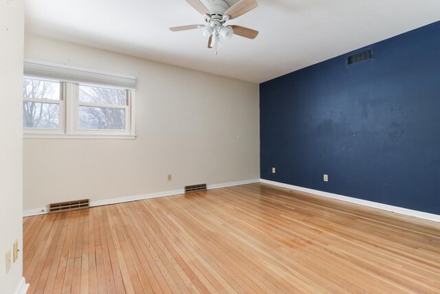 unfurnished room with ceiling fan and light hardwood / wood-style floors