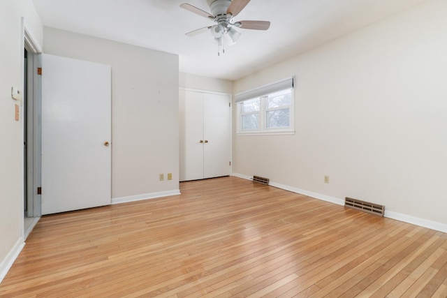 unfurnished bedroom with ceiling fan and light hardwood / wood-style flooring