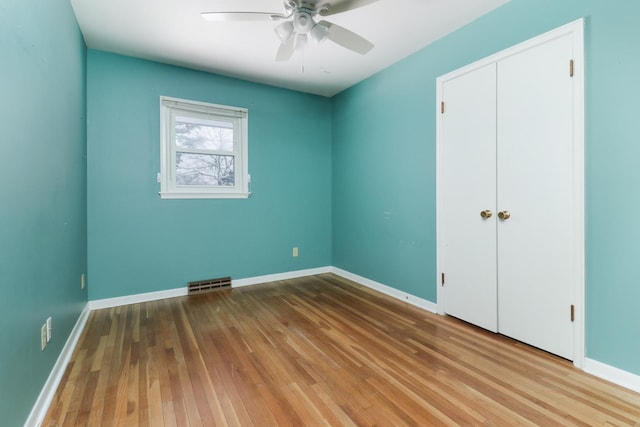 spare room featuring ceiling fan and wood-type flooring