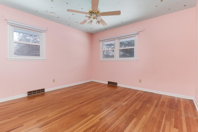 unfurnished room featuring ceiling fan and light wood-type flooring