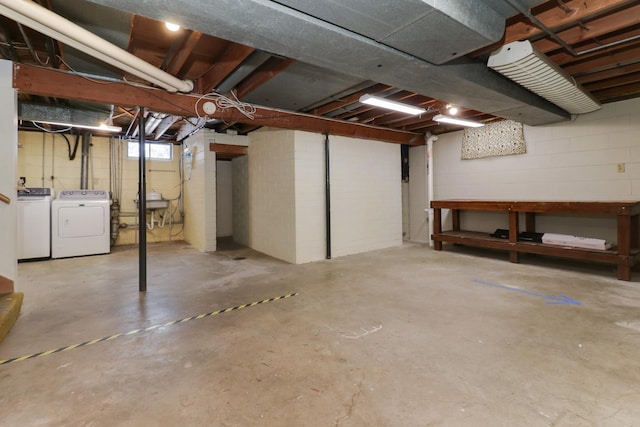 basement featuring washer and clothes dryer