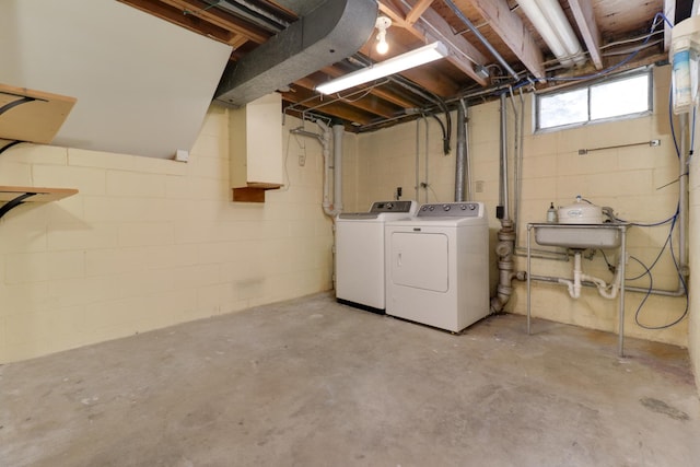 basement with independent washer and dryer and sink