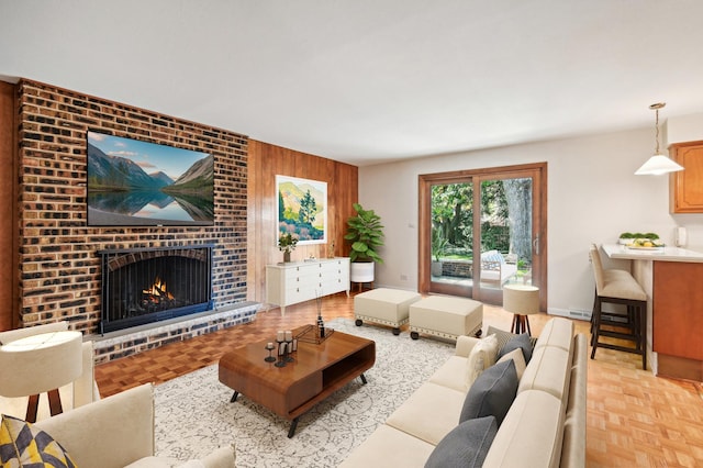 living room with a fireplace and light parquet flooring