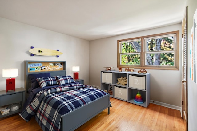 bedroom with light hardwood / wood-style flooring