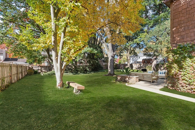 view of yard with outdoor lounge area and a patio