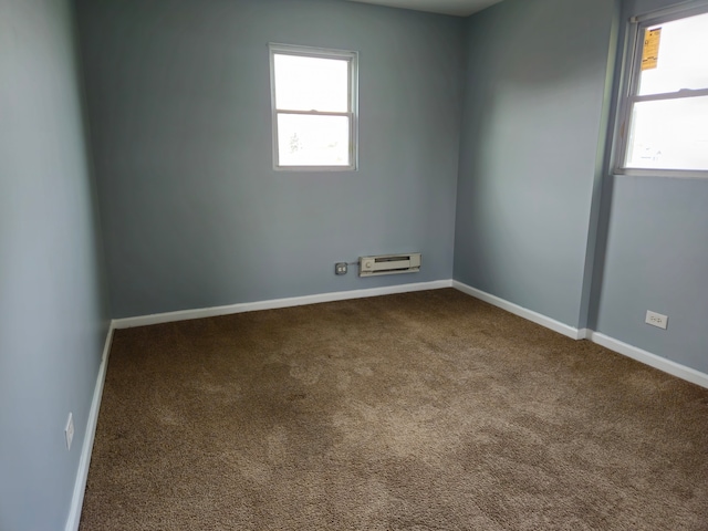 carpeted empty room with a healthy amount of sunlight